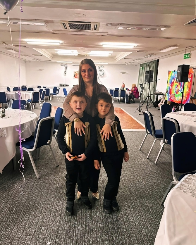 A portrait of Shannon, the founder, with her two sons